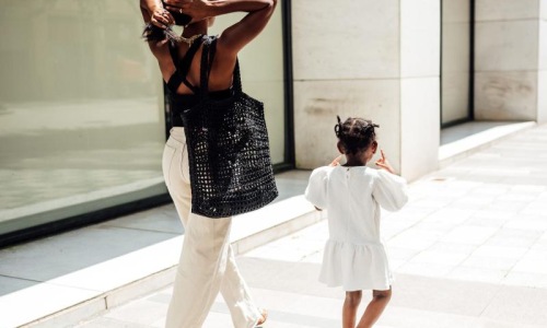 The essence of exceptional living a woman walking with her child